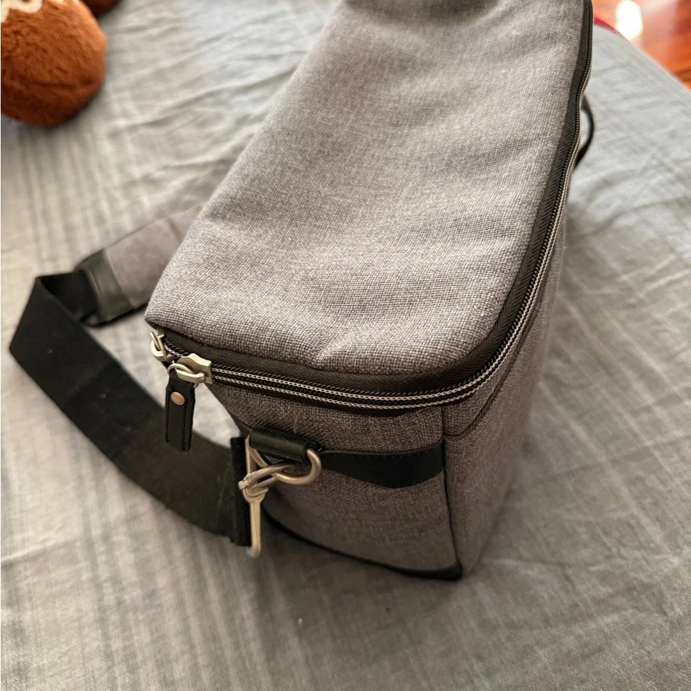 Grey canvas messenger camera bag with 2 removable/changeable compartments